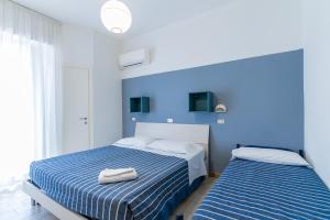 Postel nebo postele na pokoji v ubytování Hotel Atlas