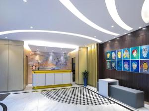 a lobby with a counter in a building at Magnotel Shanghai Maglev Station in Shanghai