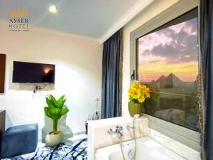 TV/trung tâm giải trí tại NEW ASSER HOTEL PYRAMID