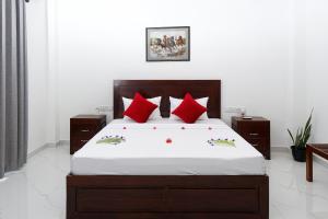 En eller flere senge i et værelse på Blue Breeze Tangalle