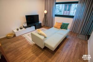 En eller flere senge i et værelse på Apartamentos da Travessa T1