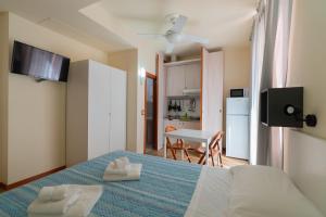 Giường trong phòng chung tại Residence Rosa