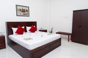 En eller flere senge i et værelse på Blue Breeze Tangalle