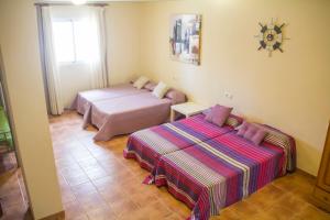 Кровать или кровати в номере Casa José