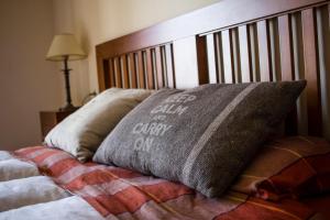 a bed with a blanket and a pillow on it at Casa José in La Herradura
