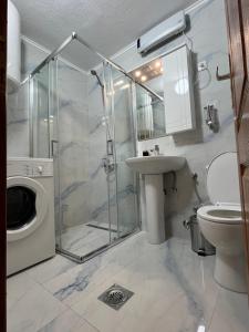 a bathroom with a shower and a toilet and a sink at Rakocevic house in Kolašin +9 photos