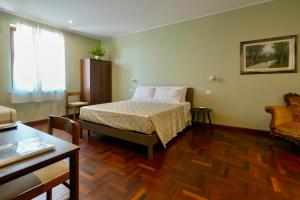 En eller flere senge i et værelse på Domus Fabia - Rooms & Apartments