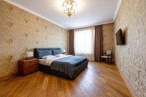 Кровать или кровати в номере Luxury Apartment III