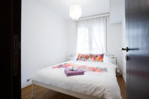 A bed or beds in a room at Prima Apartmani Beograd