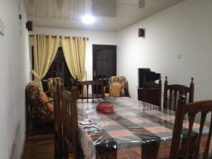 a dining room with a table and chairs at Nuwara Eliya Homestay in Nuwara Eliya