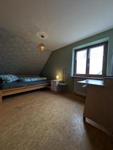 Postel nebo postele na pokoji v ubytování Ferienwohnung Haus Poppis