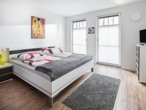 En eller flere senge i et værelse på Villa Brunnenhof 1