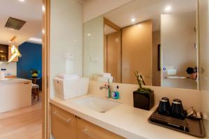 Koupelna v ubytování Qingdao Yiran Wanjia Hotel Apartment (May Fourth Square Wanxiang City Branch) + 60 fotografií