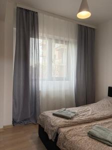 Giường trong phòng chung tại Class Park Residence