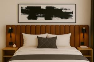 En eller flere senge i et værelse på The Spear Guest Lodge