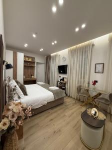 a bedroom with a large bed and a desk at Bala Dream House in Verano Brianza