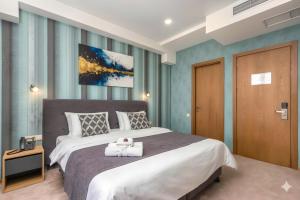 Ένα ή περισσότερα κρεβάτια σε δωμάτιο στο Brooch Boutique Hotel +40 φωτογραφίες