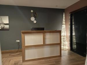 a living room with a shelf and a television at EK'sPEAK in Kumasi