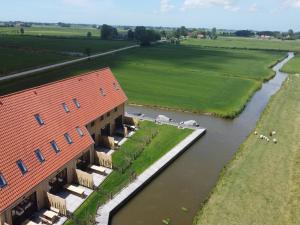 an aerial view of a building next to a river at Spacious holiday home in Leons with garden in Leons