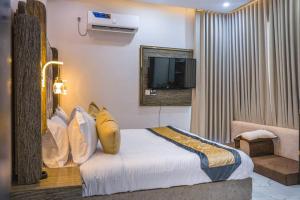 Postel nebo postele na pokoji v ubytování Horizon Aden + 5 fotografií