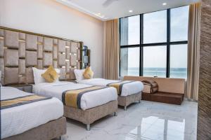 Postel nebo postele na pokoji v ubytování Horizon Aden