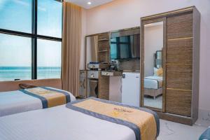 Postel nebo postele na pokoji v ubytování Horizon Aden