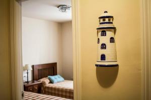 a door to a room with a lighthouse on the wall at Casa José in La Herradura