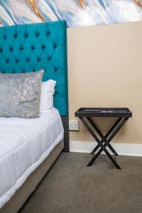 Ένα ή περισσότερα κρεβάτια σε δωμάτιο στο Chic Alberton