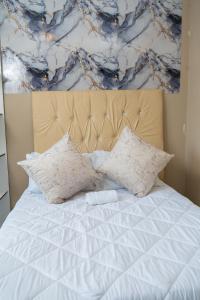 Ένα ή περισσότερα κρεβάτια σε δωμάτιο στο Chic Alberton