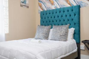 Ένα ή περισσότερα κρεβάτια σε δωμάτιο στο Chic Alberton