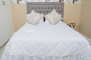 Ένα ή περισσότερα κρεβάτια σε δωμάτιο στο Chic Alberton