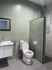 a bathroom with a toilet and a sink at บ้านไร่สกายดาว in Pak Chong +36 photos