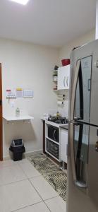 Køkken eller tekøkken på Kitnet compacta e acolhedora