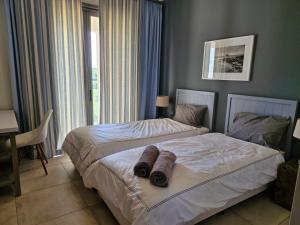 En eller flere senge i et værelse på Royal park