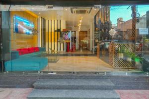 a glass window of a store with a couch in it at Hotel Kashmir inn Just 2 Min walk from Golden Temple in Amritsar