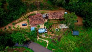 an aerial view of a house in the forest at River view cottage in Vythiri