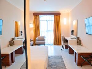 Krevet ili kreveti u jedinici u okviru objekta Asma Hotel Al Barsha