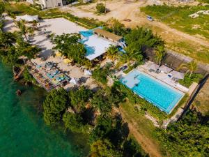 an aerial view of a resort with a swimming pool at Zanzibar,Fumbatown Cozy 1 bed Apartment in Fumba