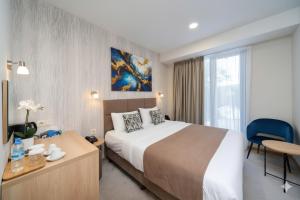 Giường trong phòng chung tại Flames boutique +35 ảnh