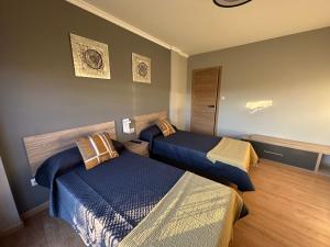 En eller flere senge i et værelse på Pensión Villa Mayer - Grupo Arcanos