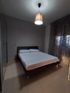 En eller flere senge i et værelse på Isola di Grazia