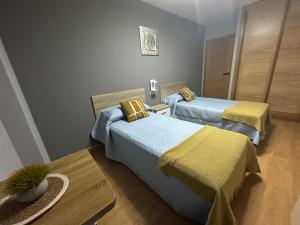 En eller flere senge i et værelse på Pensión Villa Mayer - Grupo Arcanos