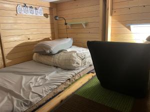 En eller flere senge i et værelse på まちやど　Motomachi + 92 billeder