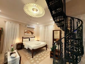 En eller flere senge i et værelse på Villa Marina -By The Beach Goa + 63 billeder