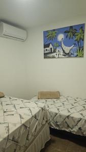 En eller flere senge i et værelse på Q 163 Apartamento TÉRREO completamente mobiliado, 02 quartos