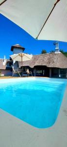 Bazén v ubytování Majestuosa Residencia con piscina Atlantida SUR 7 dorm 4 bath nebo v jeho okolí