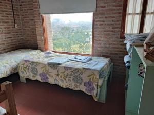 En eller flere senge i et værelse på Los Nietos