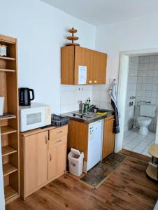 Kuchyň nebo kuchyňský kout v ubytování Zentrale Wohnung im Herzen Eisenachs für 1-2 Personen