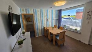 Et tv og/eller underholdning på Ferienhaus Hafenperle