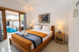 Postel nebo postele na pokoji v ubytování Summer of Surf Canggu